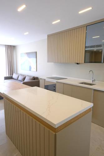 a kitchen with a large island in a room at Casa Olea Apart Hotel in Çeşme