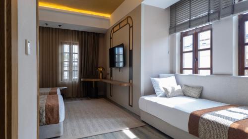 Katil atau katil-katil dalam bilik di Rempart Hotel