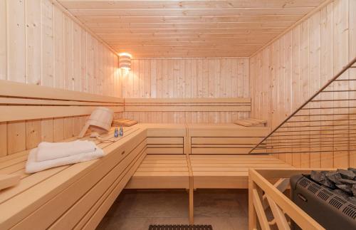 a sauna with wood paneled walls and ceilings at Alpin Chalet Schröcken in Schröcken