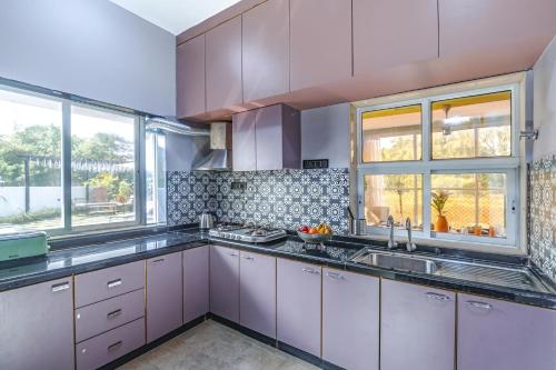 Una cocina o zona de cocina en ELIVAAS Moonlit retreat 3 BHK with Garden & Pool