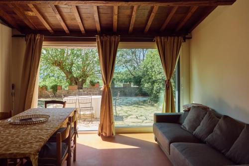 a living room with a couch and a table at Agriturismo Fattoria Poggio di Fiesole in Fiesole