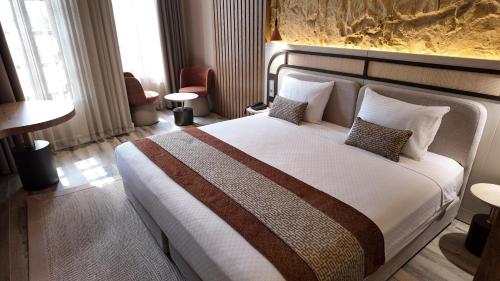 Katil atau katil-katil dalam bilik di Rempart Hotel
