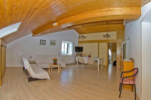 a living room with a couch and a table at Apartments Tomato in Novigrad Istria