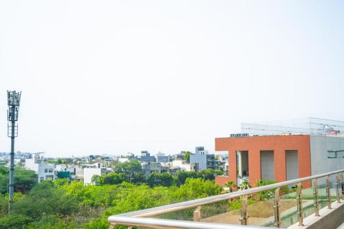 a view of a city from a balcony at Eternal Oasis by Alaya Stays, Golf Course Road in Gurgaon