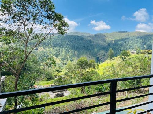 a view of the mountains from the balcony of a house at Diyon'S Lodge in Ella