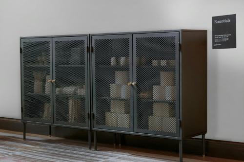 a metal cabinet with shelves in a room at Sonder by Marriott Bonvoy The Broughton Apartments Historic District in Savannah