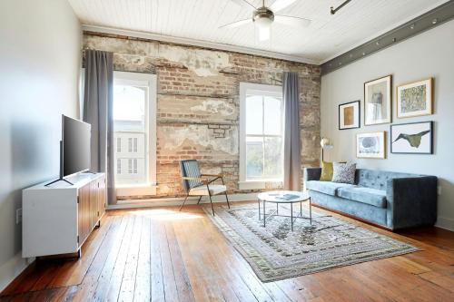 a living room with a couch and a tv at Sonder by Marriott Bonvoy The Broughton Apartments Historic District in Savannah