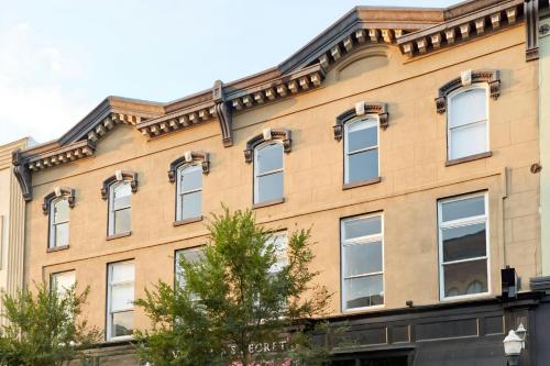 a building with many windows on the side of it at Sonder by Marriott Bonvoy The Broughton Apartments Historic District in Savannah