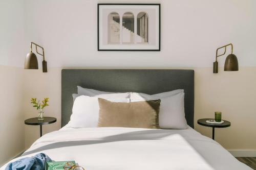 a bedroom with a large bed with two side tables at Sonder by Marriott Bonvoy The Opal Apartments River North in Chicago