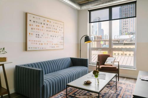 a living room with a couch and a table at Sonder by Marriott Bonvoy The Opal Apartments River North in Chicago
