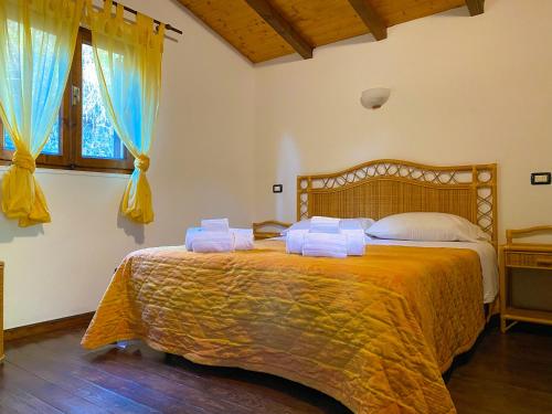 Postel nebo postele na pokoji v ubytování B&B Agriturismo 'A Cunziria