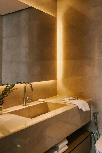 a bathroom with a sink and a mirror at Sonder by Marriott Bonvoy JBR The Walk Apartments in Dubai