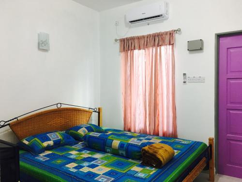 Una cama o camas en una habitación de Lyaa Resthouse