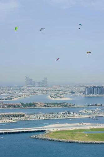 an aerial view of a river with a bridge and buildings at Sonder by Marriott Bonvoy JBR The Walk Apartments in Dubai