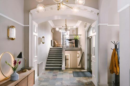 a hallway with a stairway with a stairwayngth at Sonder by Marriott Bonvoy Royal Garden Apartments New Town in Edinburgh