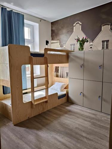 Postel nebo postele na pokoji v ubytování Dzien Dobry Hostel