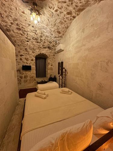Postel nebo postele na pokoji v ubytování ŞAHMERAN HOTEL&Cafee