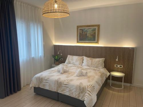 a bedroom with a large bed in a room at Hotel La Pergola di Venezia in Venice-Lido