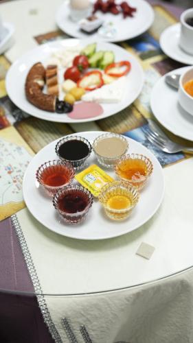 a table with plates and bowls of food on it at Akyol Palace in Bolu