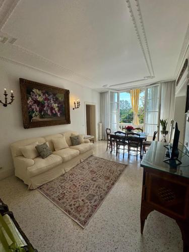 a living room with a couch and a table at Lilac Luxury Apartment in Lido