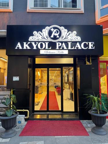 a akvlp palace sign on the front of a store at Akyol Palace in Bolu