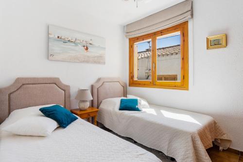 Ένα ή περισσότερα κρεβάτια σε δωμάτιο στο CB Living - 2 bedroom beach condo, Playa Flamenca