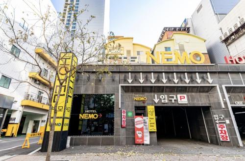 a store with a sign on the front of a building at Sangmu Nemo Hotel in Gwangju