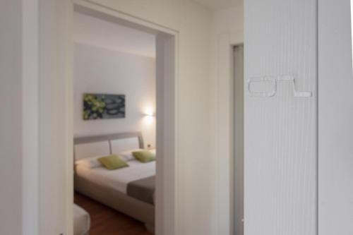 Кровать или кровати в номере B&B White con Parcheggio Privato