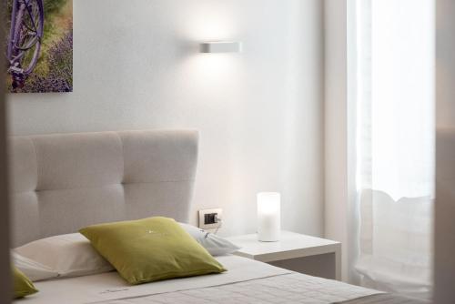 Кровать или кровати в номере B&B White con Parcheggio Privato