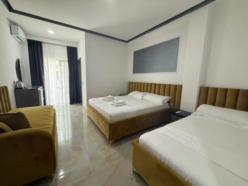 Postel nebo postele na pokoji v ubytování Hotel Leodori 1