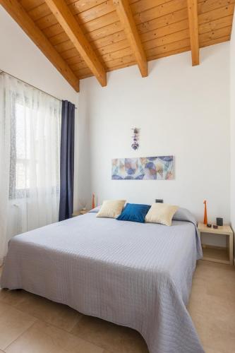 Ένα ή περισσότερα κρεβάτια σε δωμάτιο στο Terrazza Hikari Villacidro