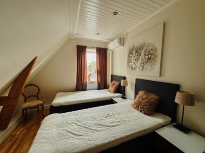 Postel nebo postele na pokoji v ubytování Paradise-Silvergruvan