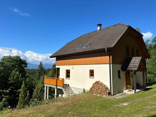 a small house on top of a hill at Villa Sara - Wörtherseeblick, Sauna, Panoramaterrasse in Sankt Bartlmä