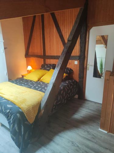 a bedroom with a large bed in a room at Le p'tit Palais in Le Palais