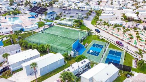 an aerial view of a tennis court in a city at Intracoastal Breezes N1173 in Jensen Beach