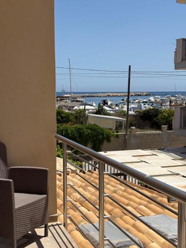 a balcony with a view of the ocean at Villa Joseph in Marzamemi
