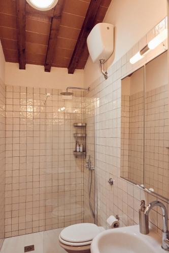 a bathroom with a shower and a toilet and a sink at Agriturismo Fattoria Poggio di Fiesole in Fiesole