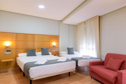Postel nebo postele na pokoji v ubytování Hotel Alda Xinzo