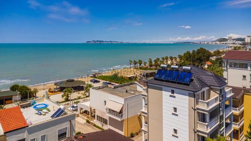 an aerial view of the beach and buildings at Sea La Vie Apartment in Golem