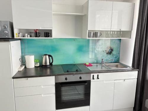 Una cocina o zona de cocina en ÁTRIUM Apartman Kaposvár
