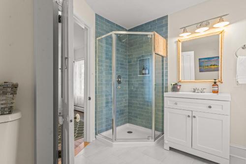 a bathroom with a shower and a sink at Charming 4BR Victorian Mystic Downtown in Groton