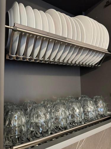 a bunch of plates and glasses on a shelf at Casa DeDa-Mare & Design on the Trabocchi Coast in Fossacesia