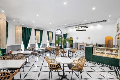 a restaurant with tables and chairs and a counter at Yangshuo KIRA Hotel - Moroccan Style in Yangshuo