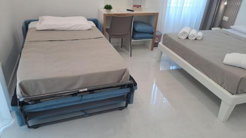 Katil atau katil-katil dalam bilik di Diamond Rooms Tropea