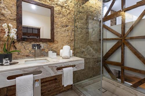 a bathroom with a sink and a mirror at 54 Santa Catarina Apartments in Lisbon