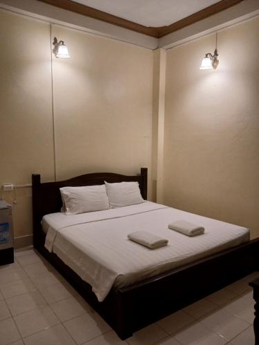 Ένα ή περισσότερα κρεβάτια σε δωμάτιο στο DokPhut Guesthouse