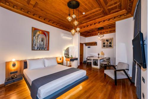 a hotel room with a bed and a desk at Elmira Pera Hotel & - Special Class in Istanbul