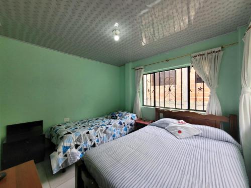 Postel nebo postele na pokoji v ubytování Hospedaje Roca Firme Choachi