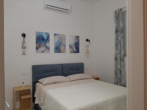 Postel nebo postele na pokoji v ubytování Casa vacanze il sorriso di Eva