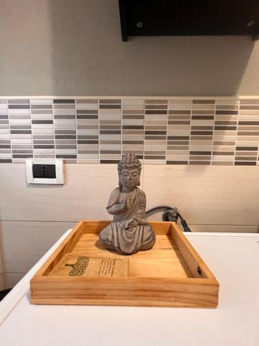 a statue sitting in a box on a table at Ma Maison Hospital University School in Brescia